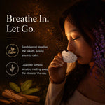 Woman smelling a Sayang Sleep Strip scented with sandalwood and lavender beside the words “Breathe In. Let Go.”